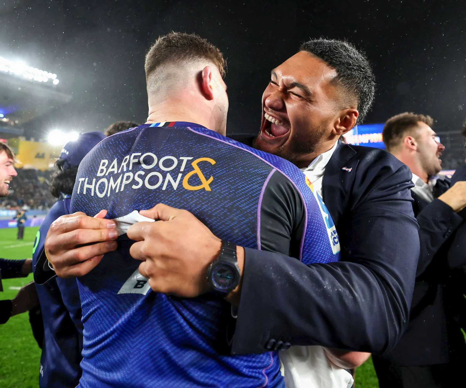 Hugging Blues captain Dalton Papali'i excitedly after a competition win