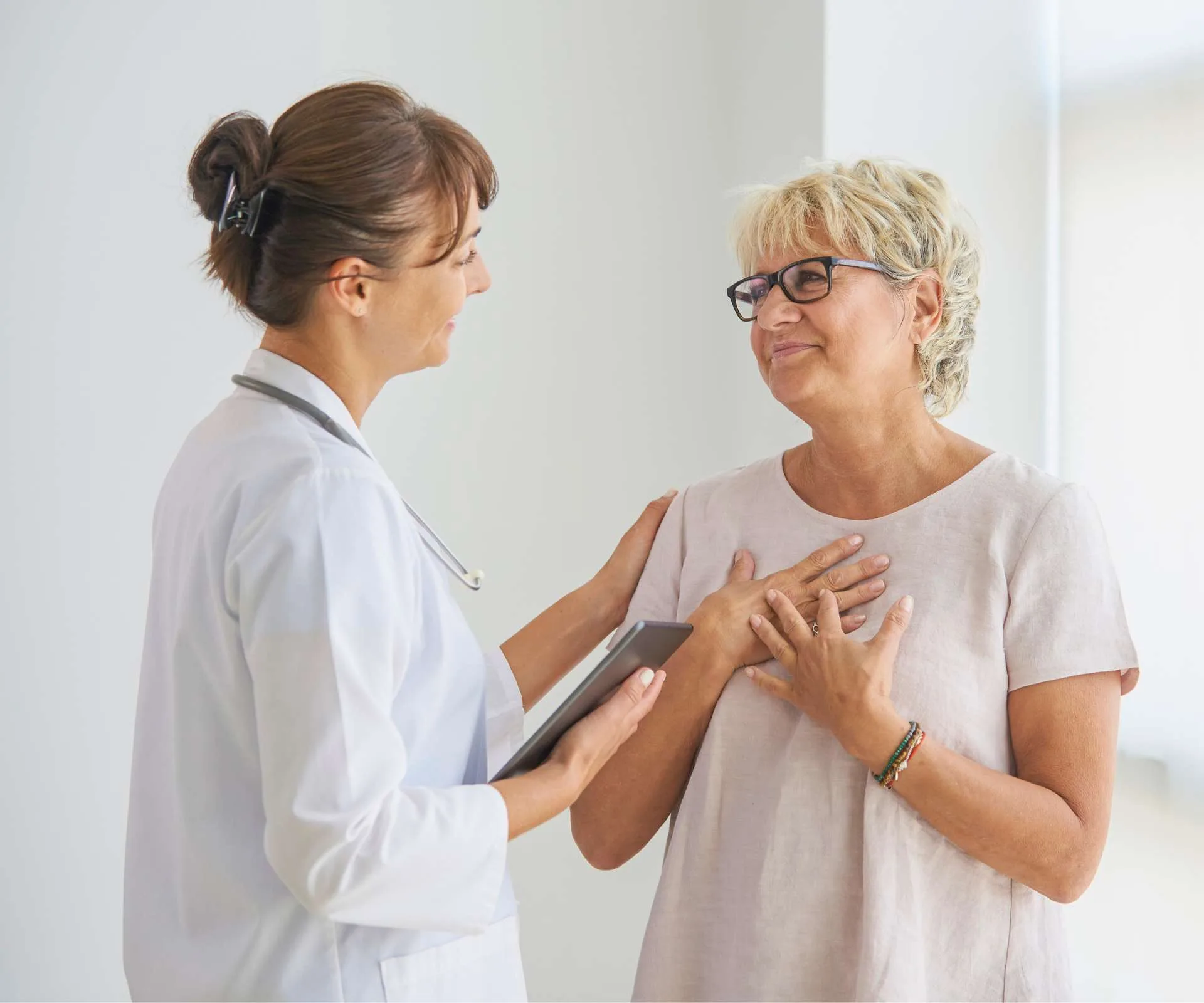 A woman talking to a doctor about HRT