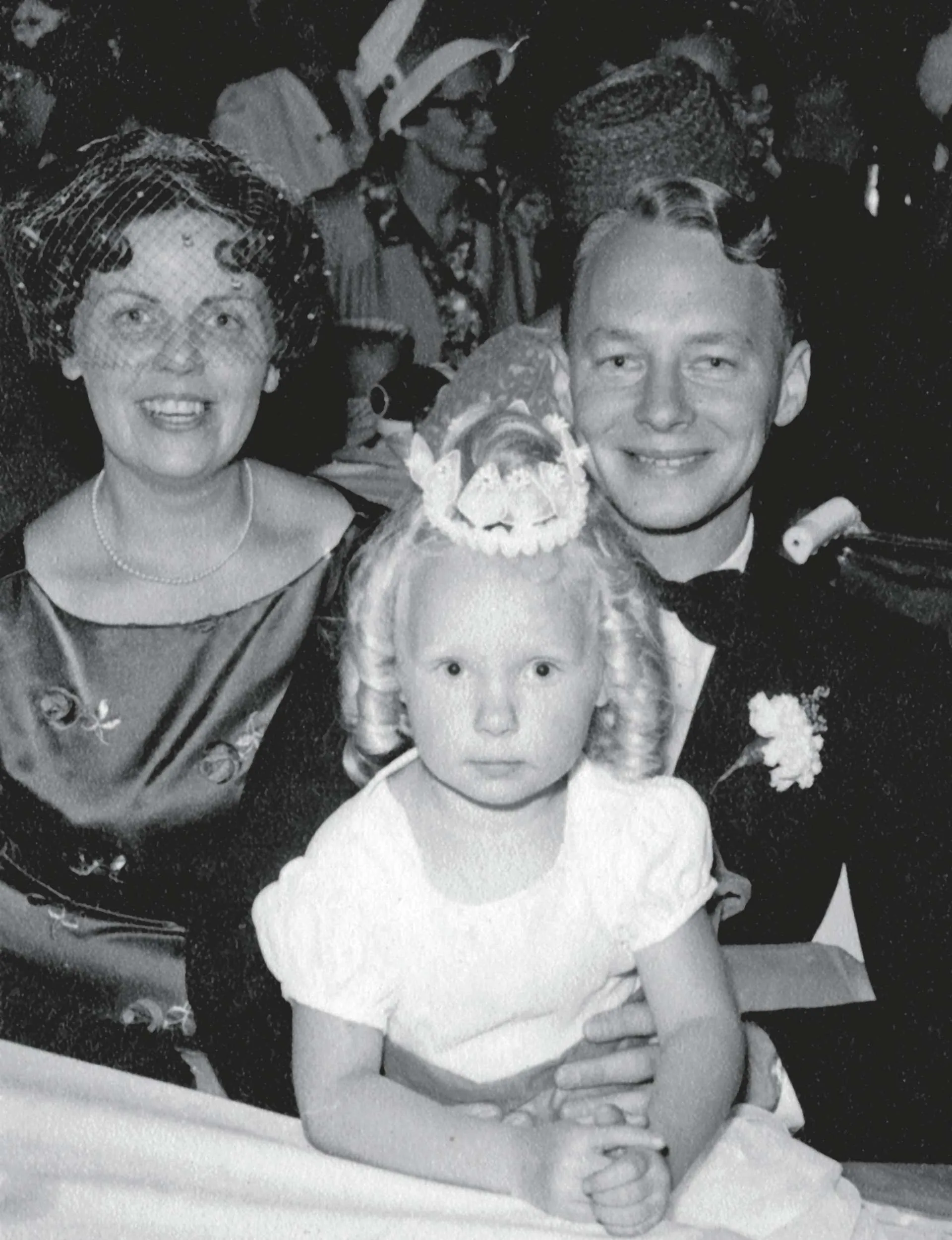 A black and white photo of young Desley with her parents