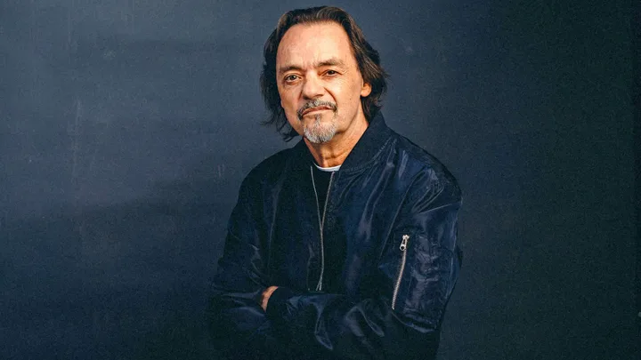 Jimmy Brown in front of a dark background