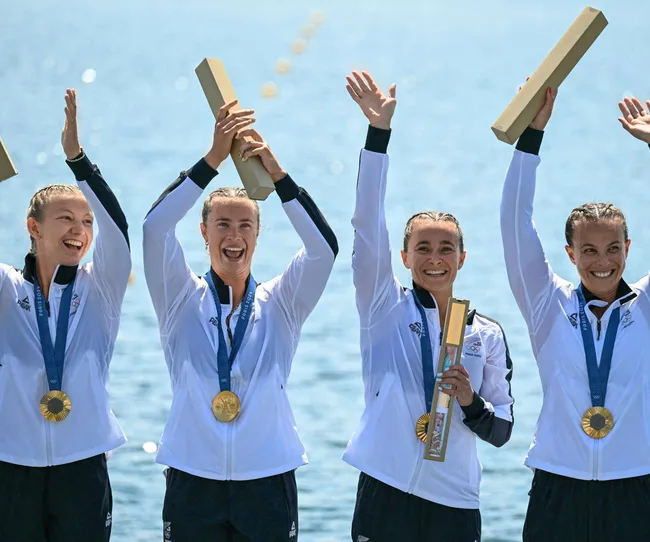 Dame LIsa Carrington and her Canoe squad celebrating at the 2024 Paris Olympics