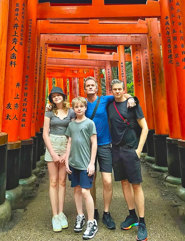 Celeb dad Neil Patrick Harris with his kids under a temple