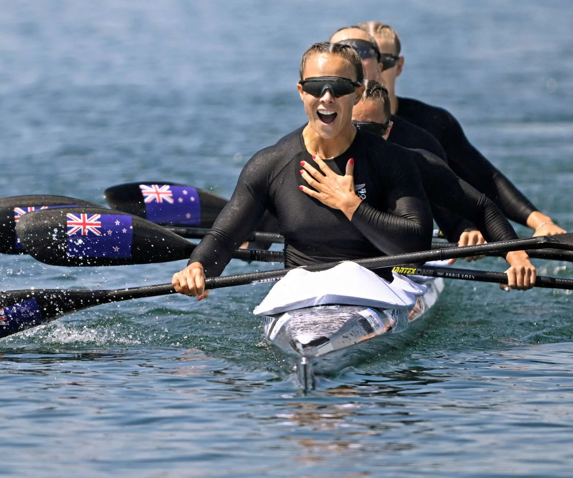Lisa Carrington after a race with her crewmates at the 2024 Olympics