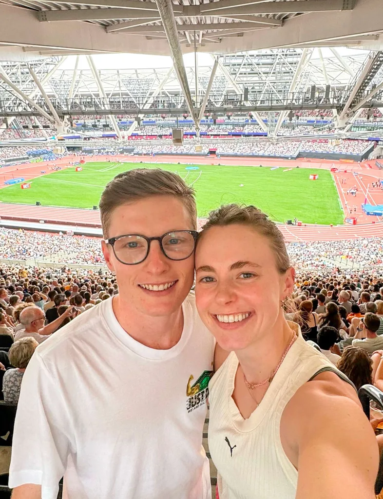 Anna Grimaldi and Jaryd taking a selfie in front of a stadium