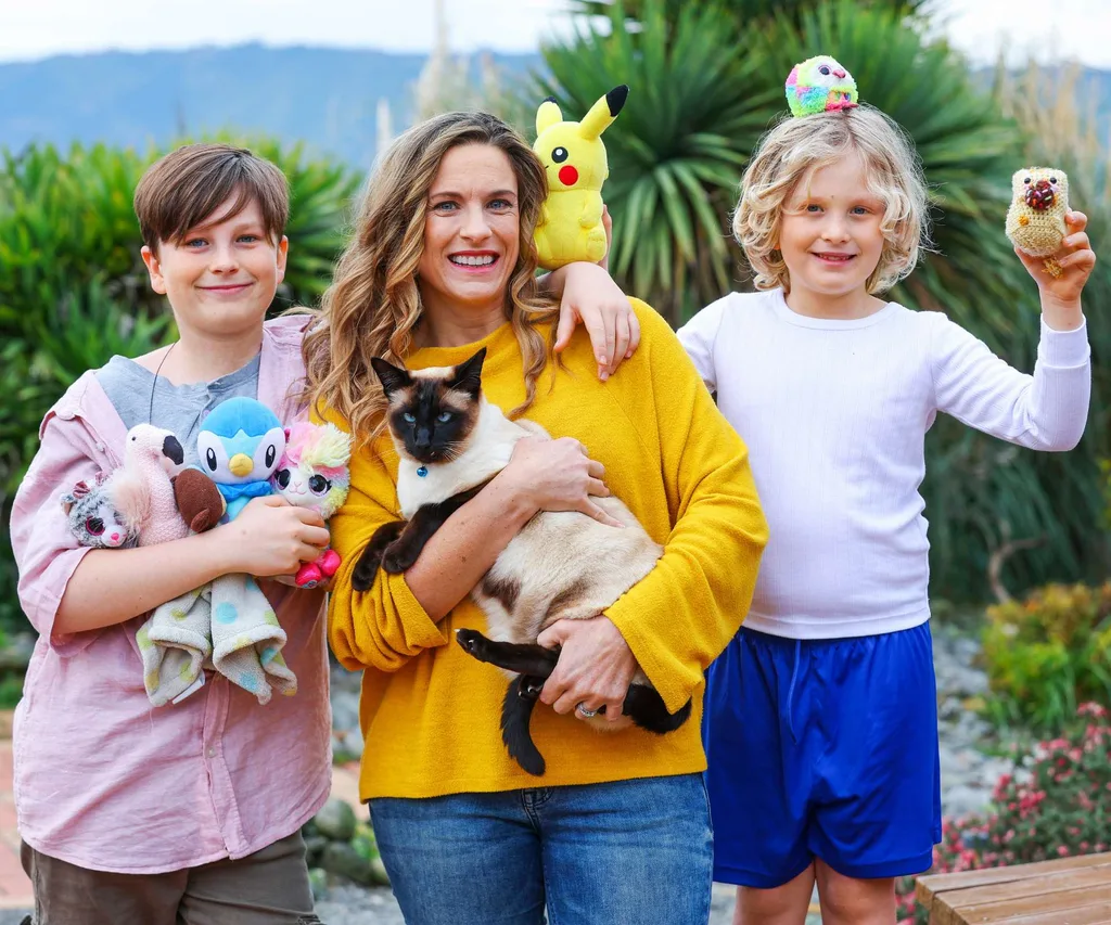 Milo with his family, the kids holding his stolen toys