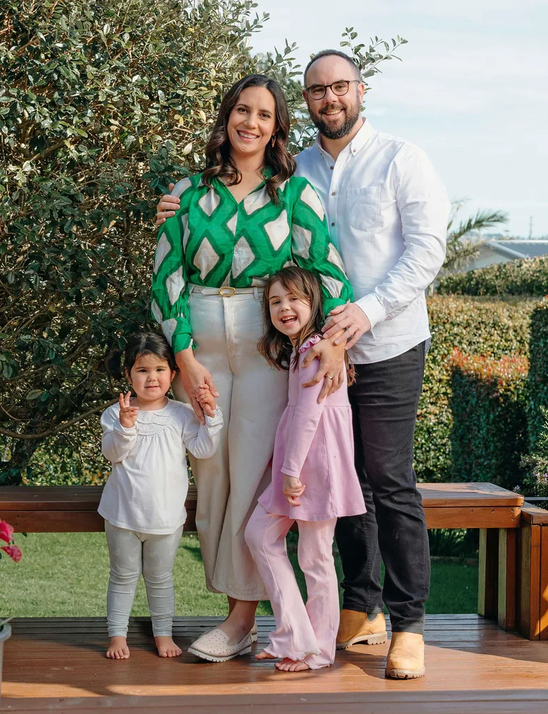 Laura Tupou with her family on a porch