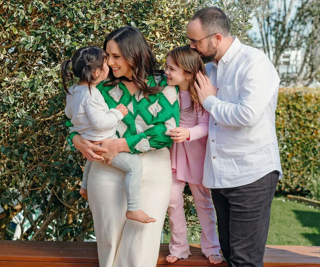 Laura Tupou with her family on a porch