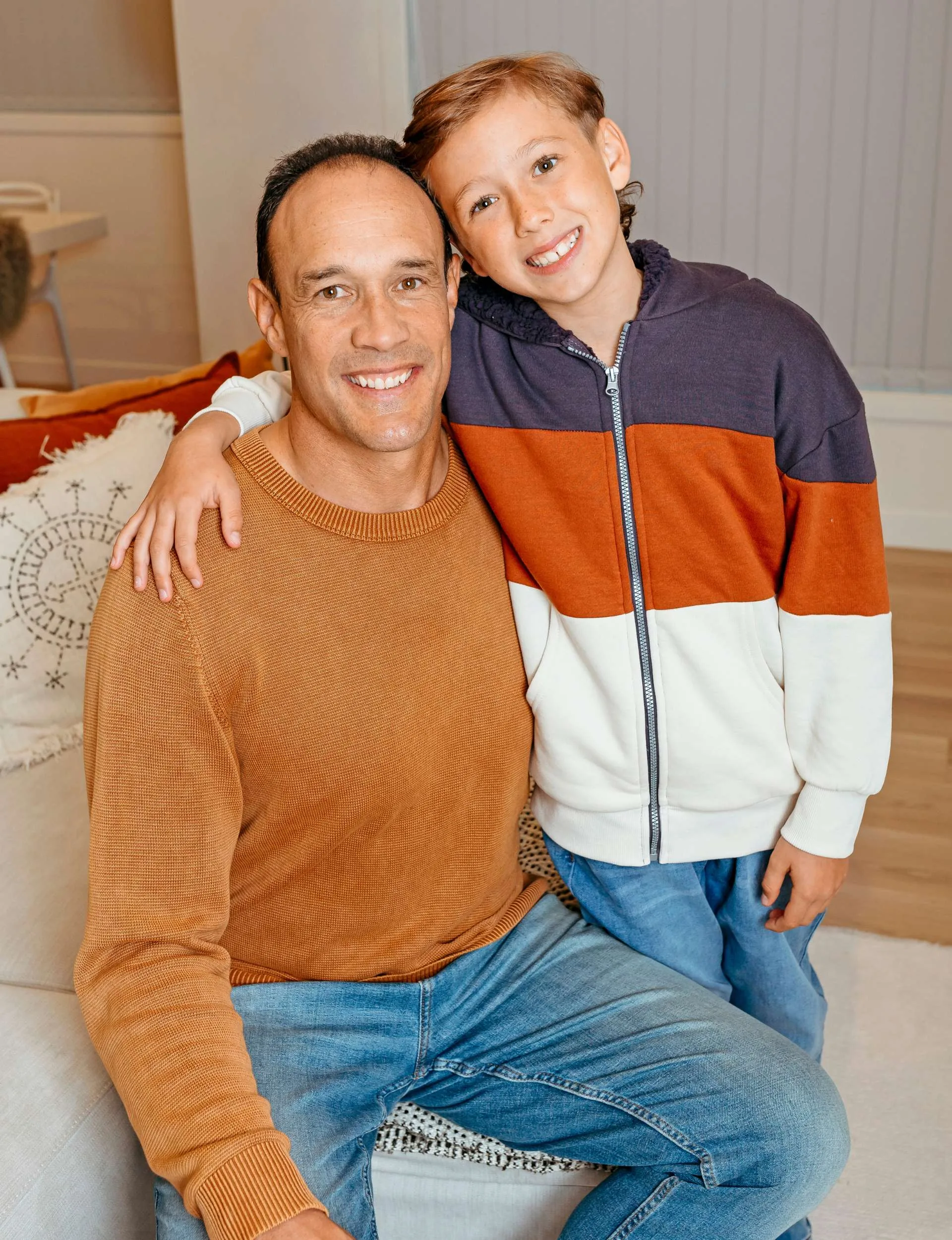 Logan Swann with his arm around his son Cole's shoulder