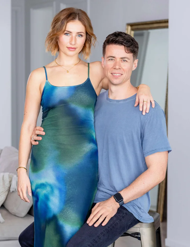 Sophie Brown standing with her arm around boyfriend Jimmy's shoulder as he sits beside her on a stool