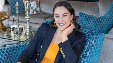 Dame Sophie Pascoe in an orange top with a black blazer over top