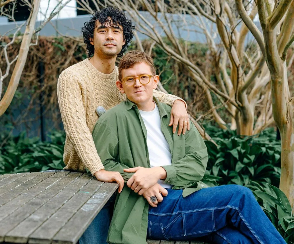 Chris and Micheal sitting at a park bench together