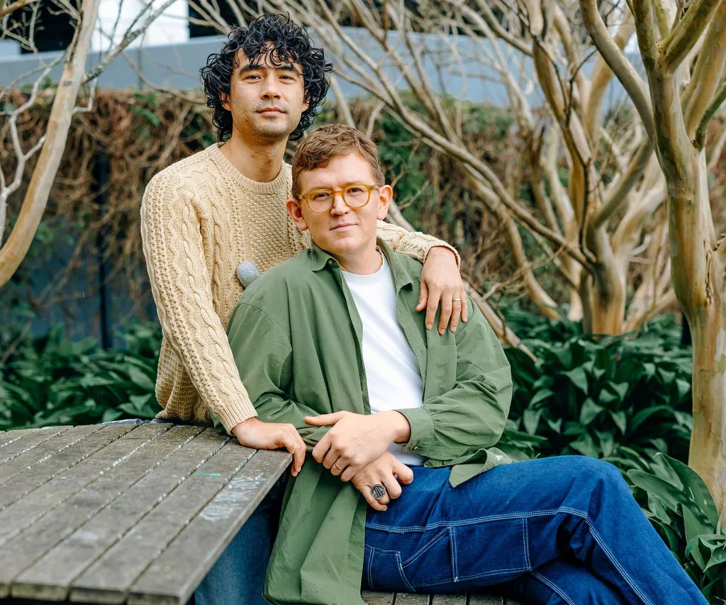 Chris and Micheal sitting at a park bench together