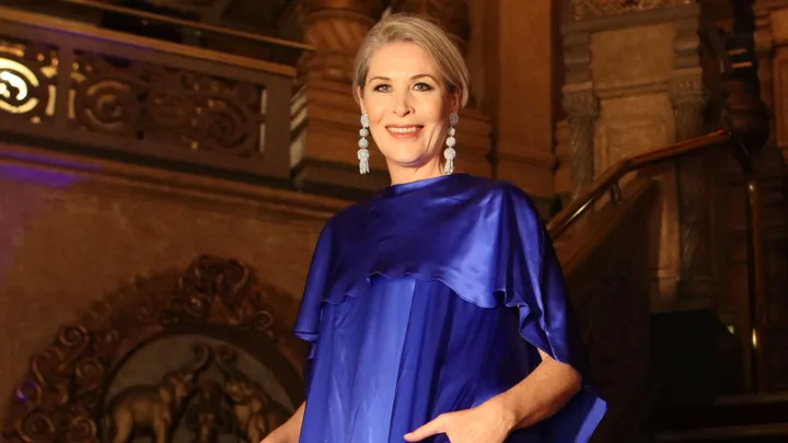 Jennifer Ward-Lealand in a satin blue dress