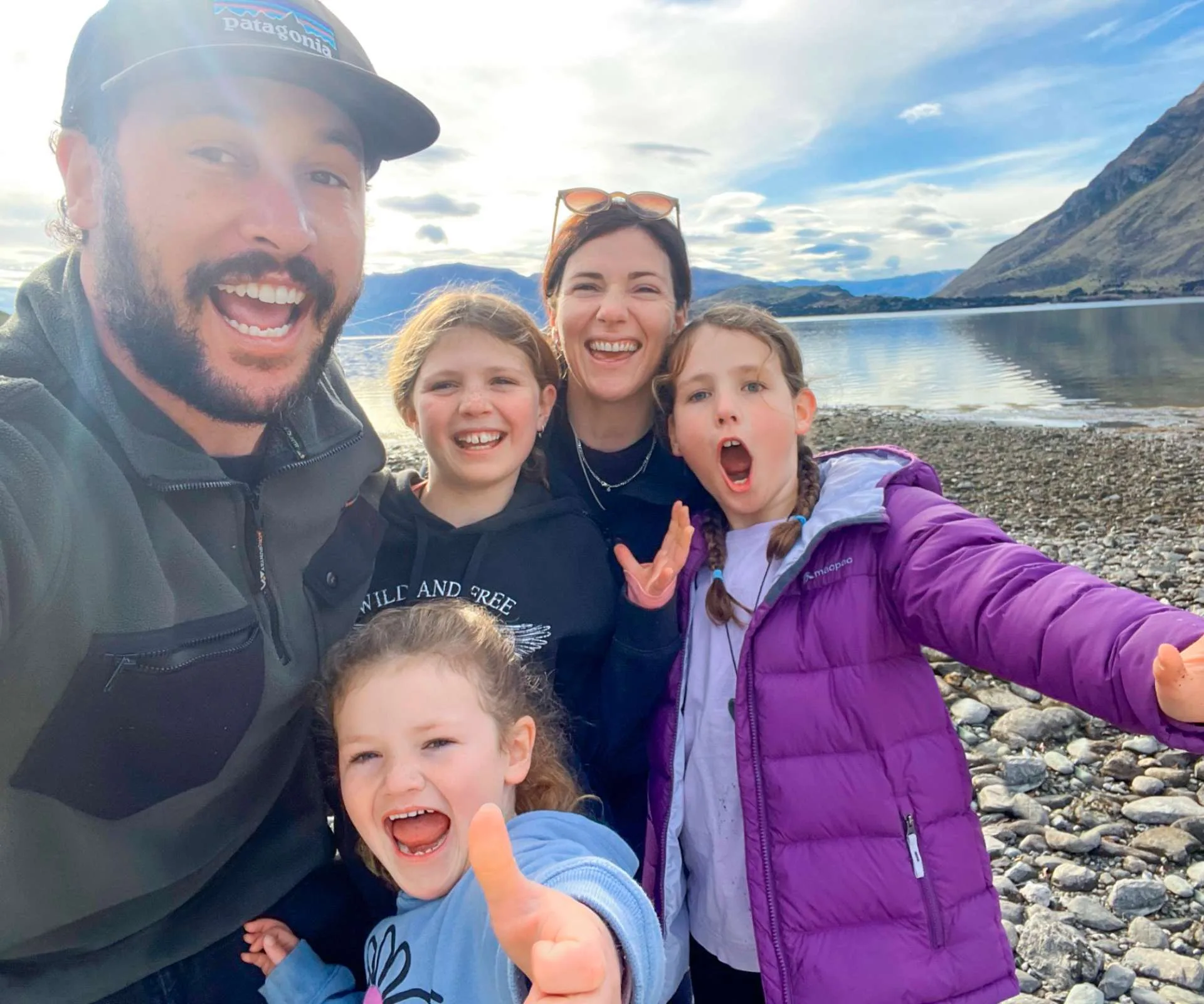 Jordan Watson taking a selfie with his wife and kids