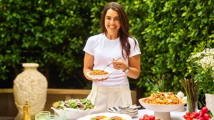 Polly holding a plate of food