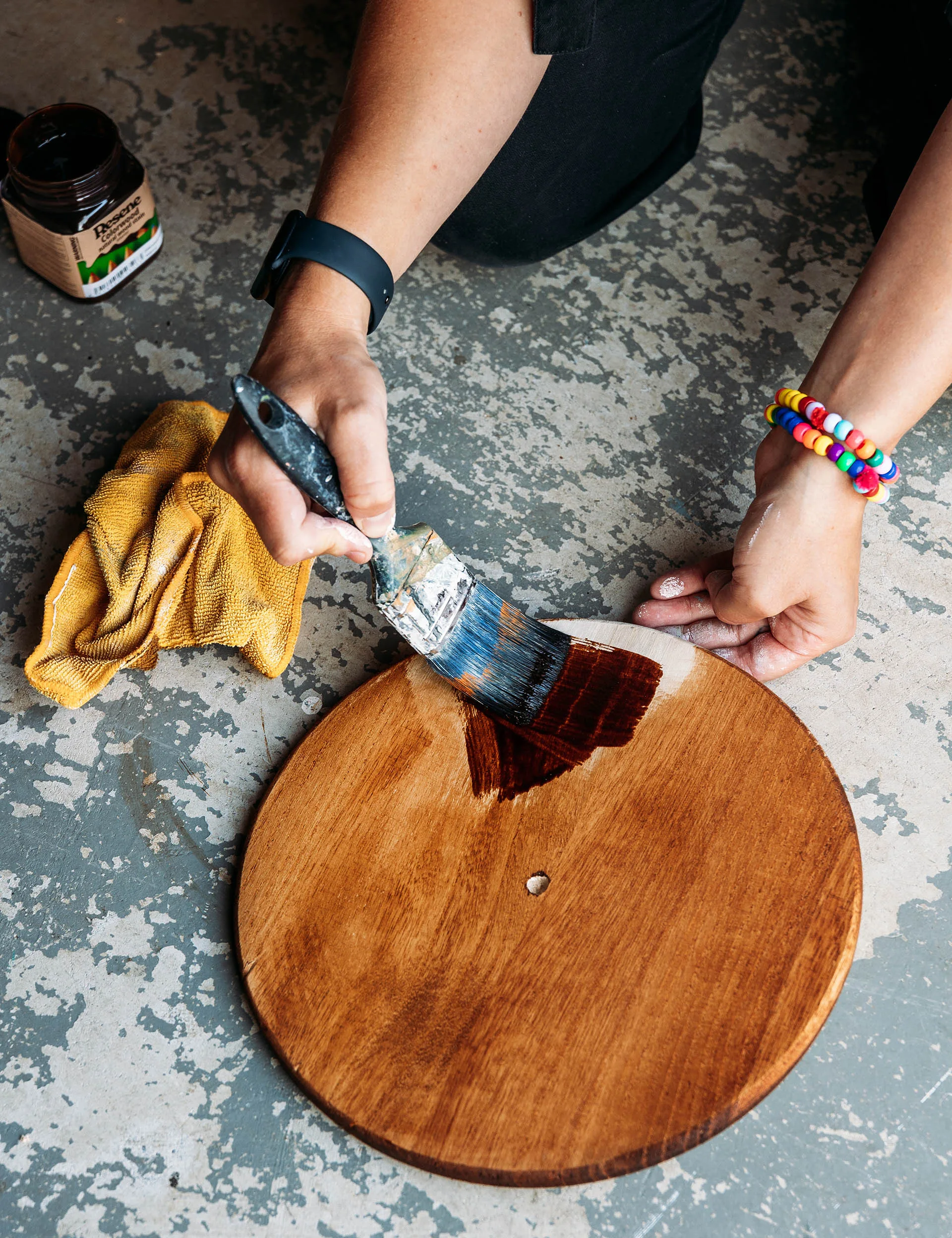 Fit the dowel into the hole of the round