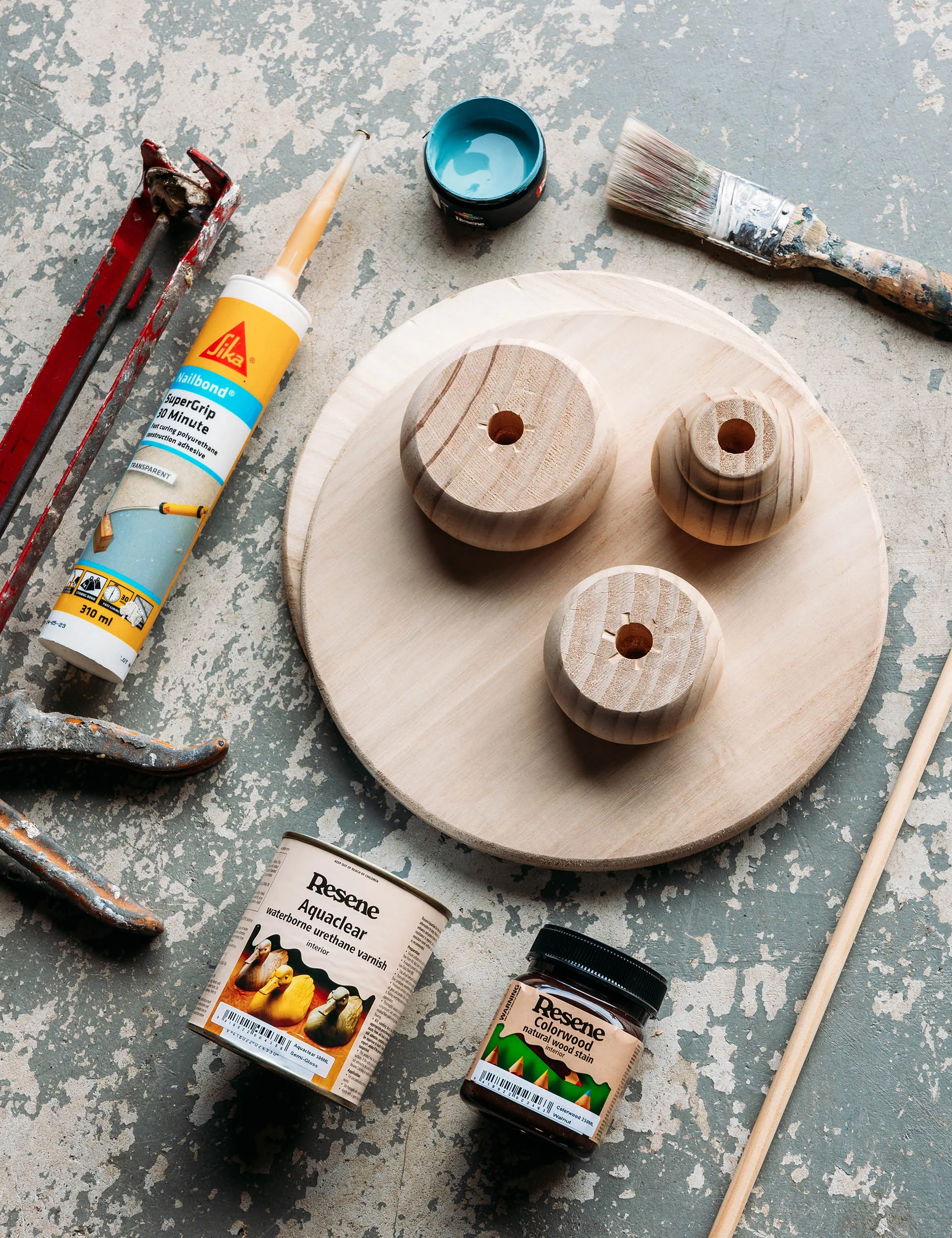 Things you will need to make a side table: wooden furniture feet, paint, drill with a 12mm drill bit, construction glue, 12mm dowel, handsaw and varnish or sealer