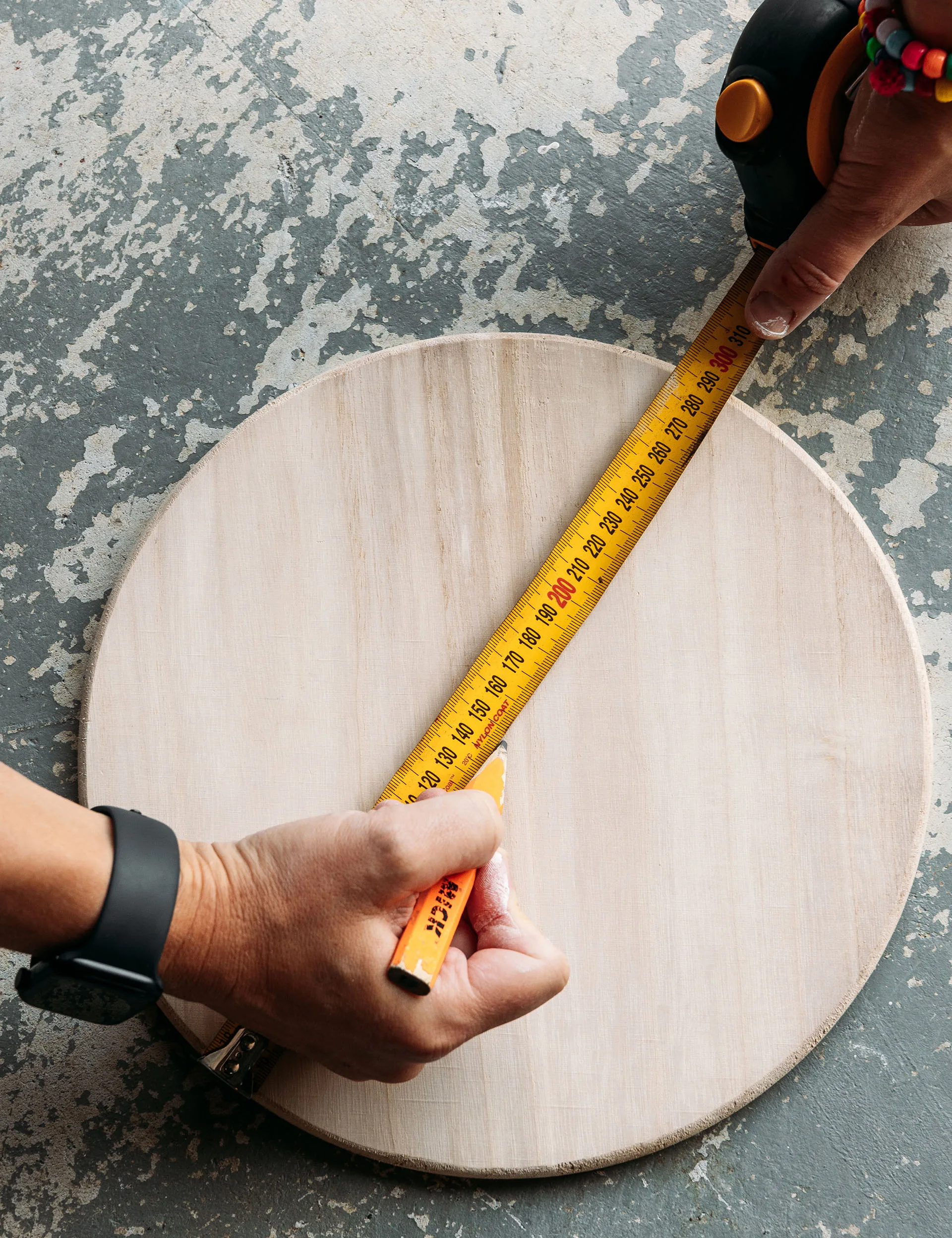 Measure the centre of your wooden craft rounds