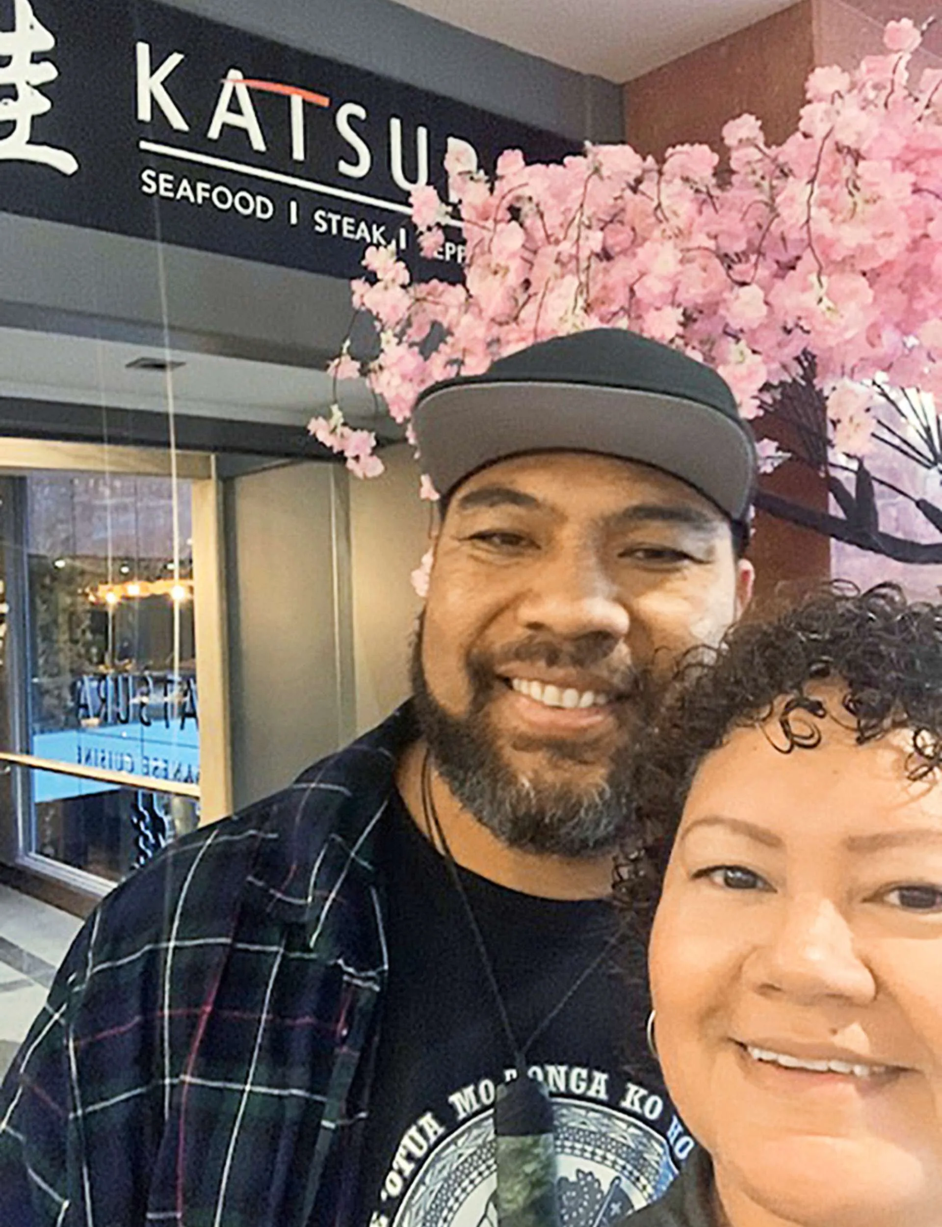 Lesley Vainikolo with his wife, Sienna in front of a Japanese restaurant