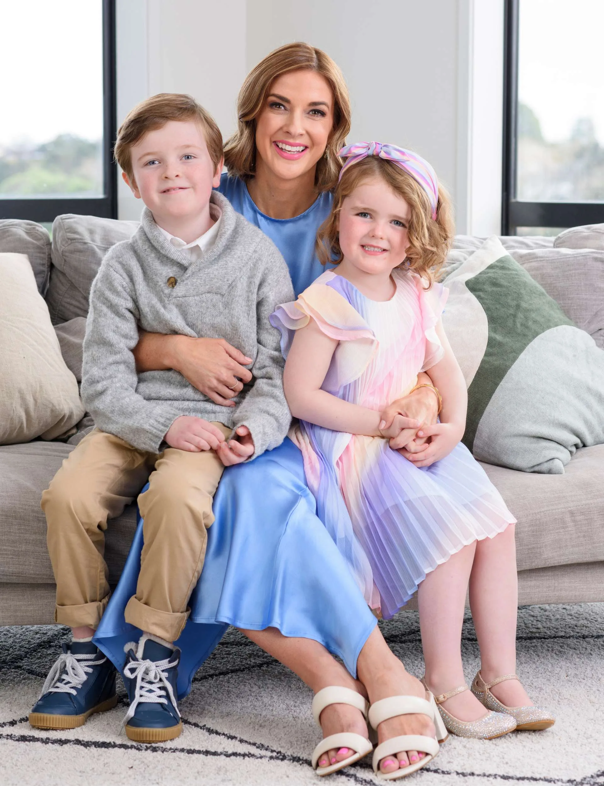 Susie Nordqvist with her kids on a couch