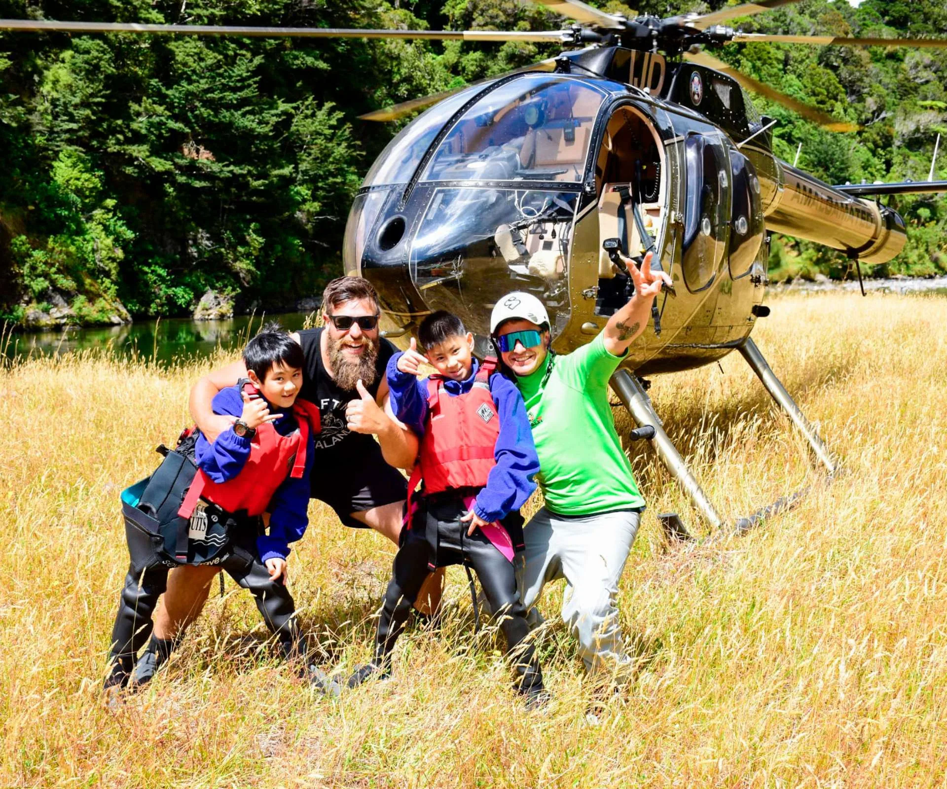 Boshu and his brother in front of a helicopter with his Big Buddy