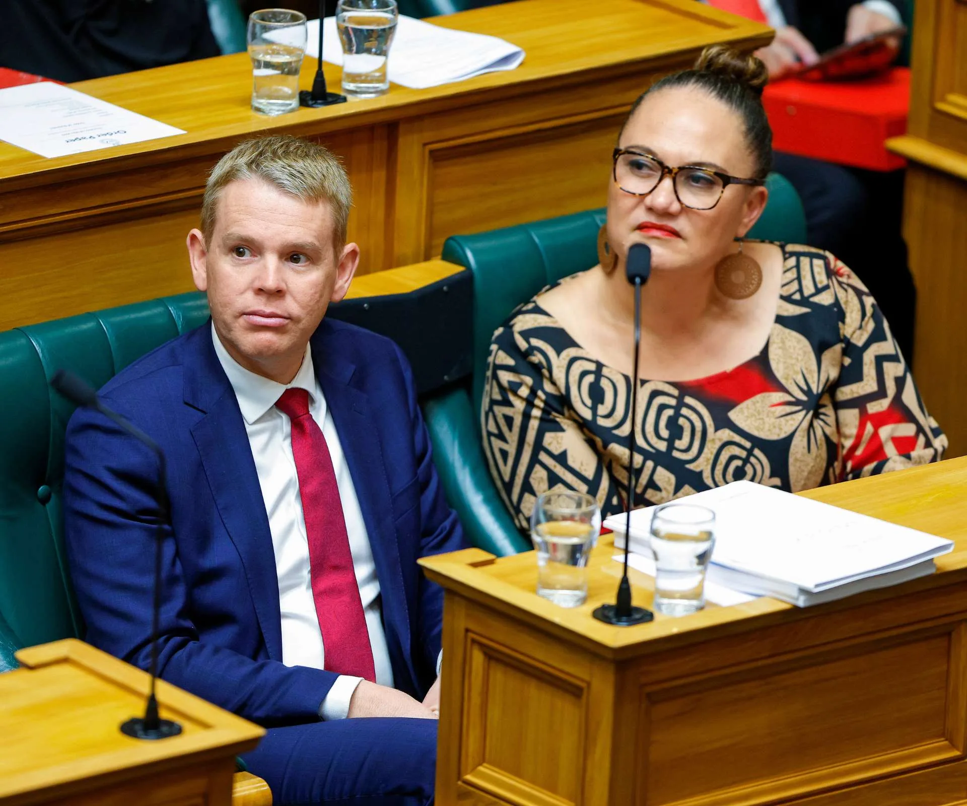 Carmel sitting beside Chris Hipkins in parliament