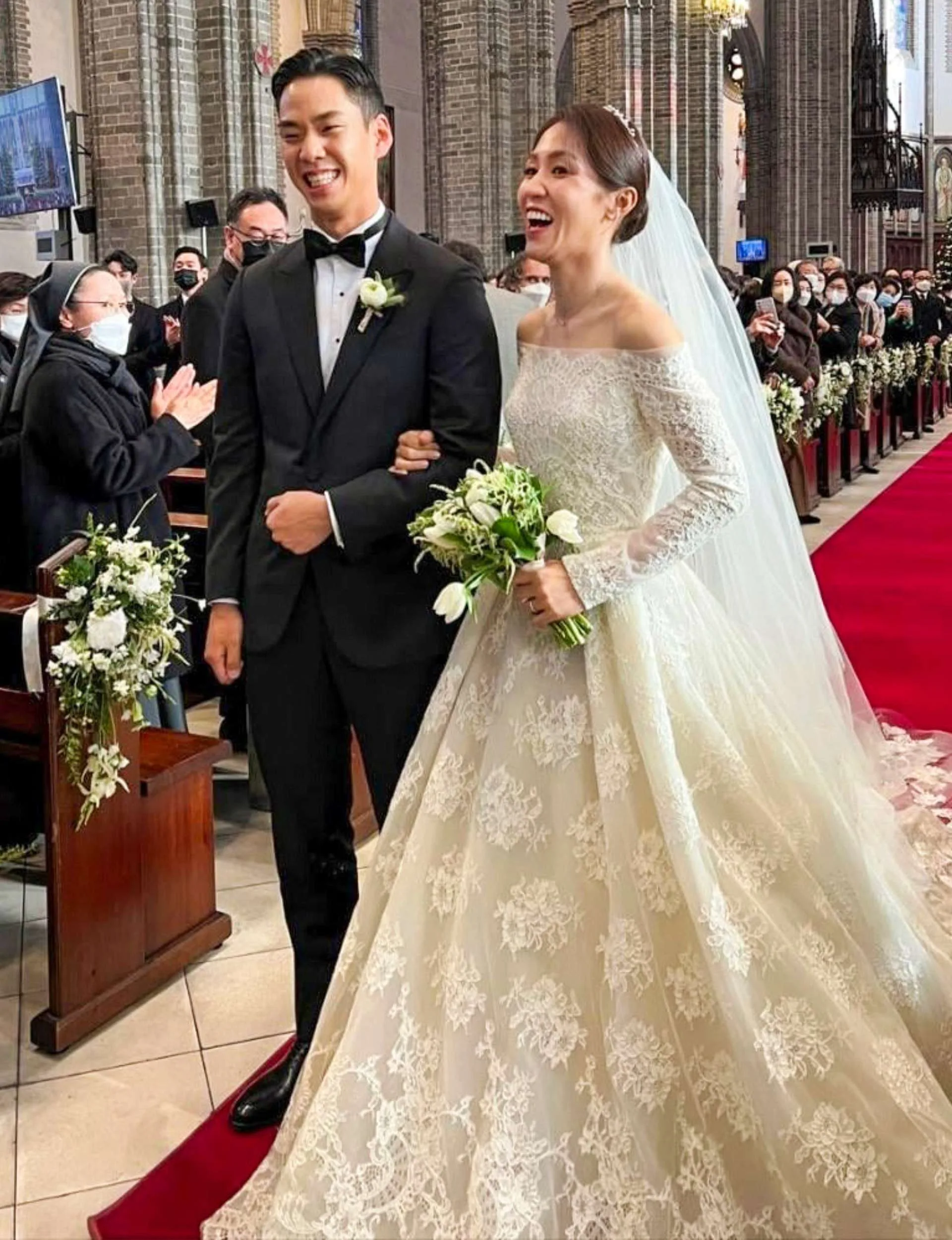Lydia Ko with her husband at their wedding