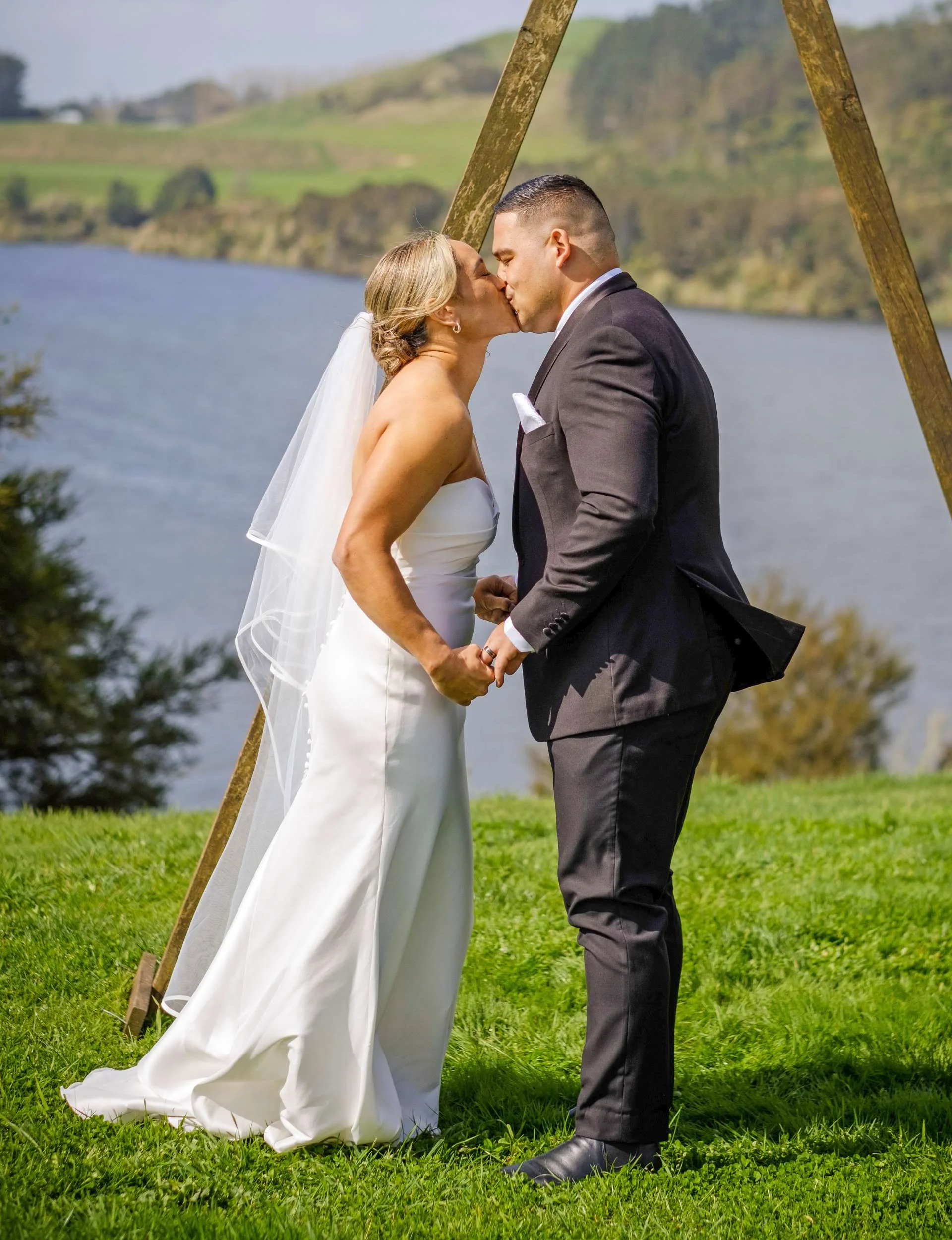 Kennedy and Solly kiss at their wedding