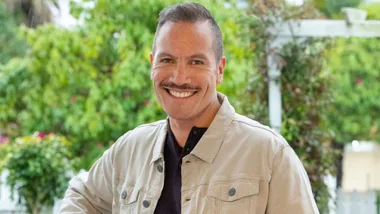 Tāmati Coffey smiling outside