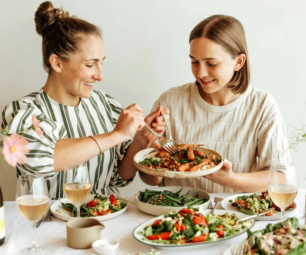 Rosa and Margo sharing a plate of healthy food