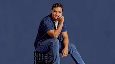 Canatona in front of a navy blue background