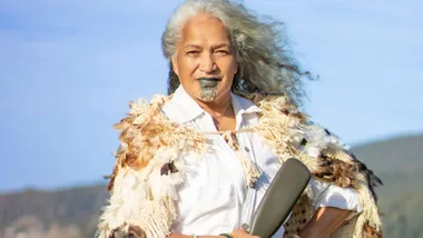 Hinetu Dell on the top of a hill with the wind blowing through her hair