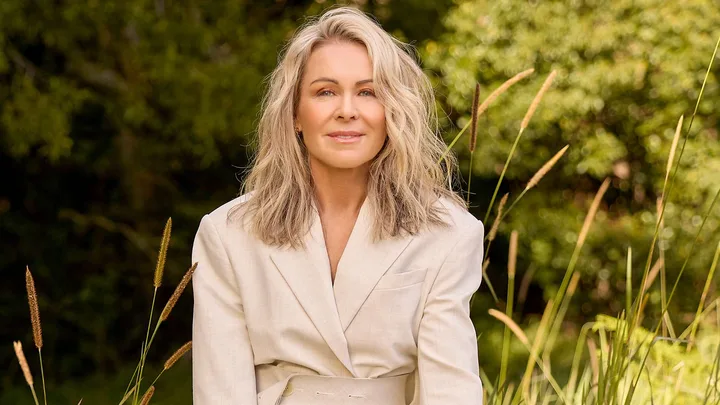 Lorna Jane outside in a cream blazer