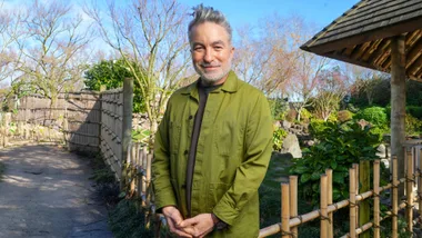 Dai Henwood in a green jacket