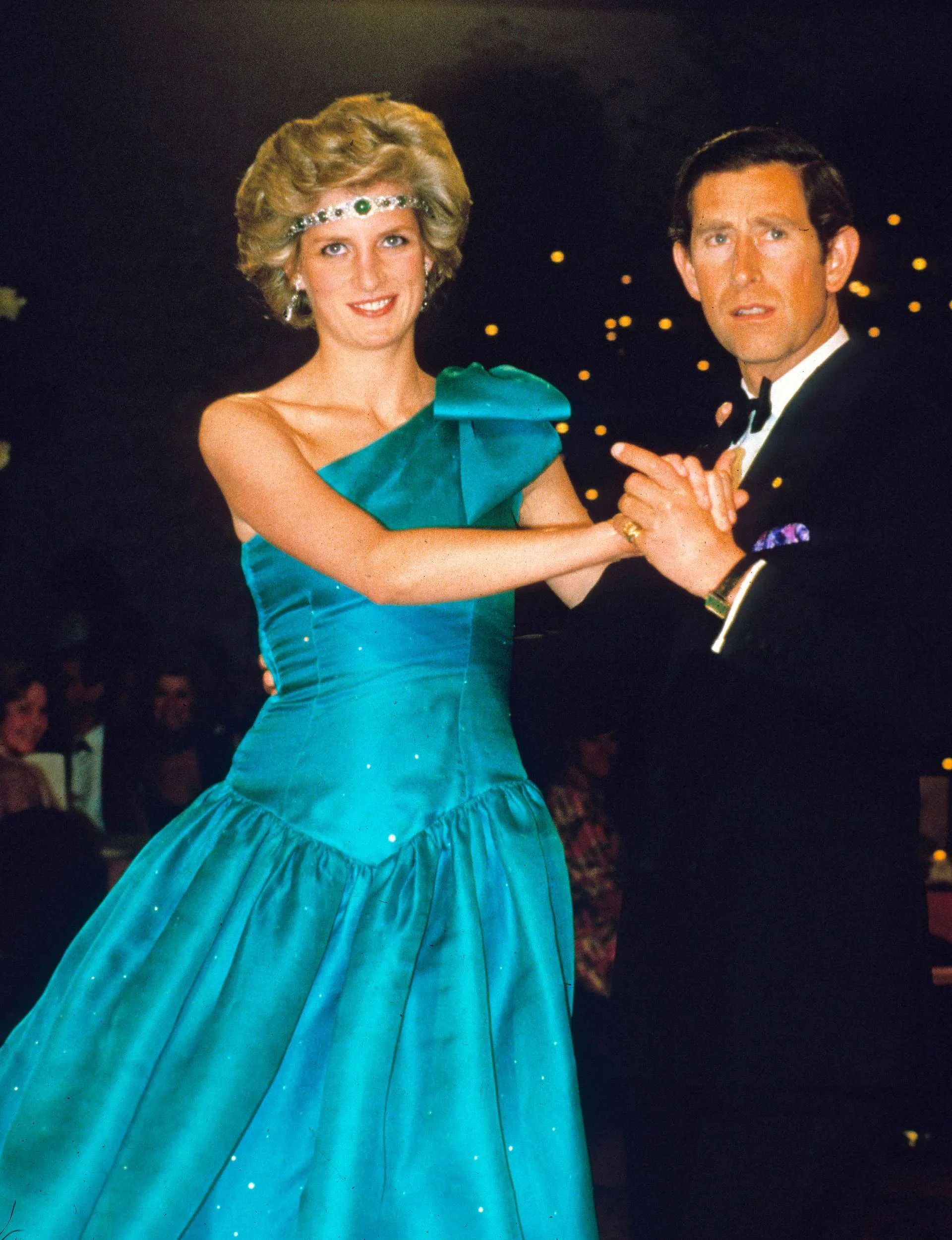 Princess Diana dancing with Charles with the late Queen's necklace as a headband