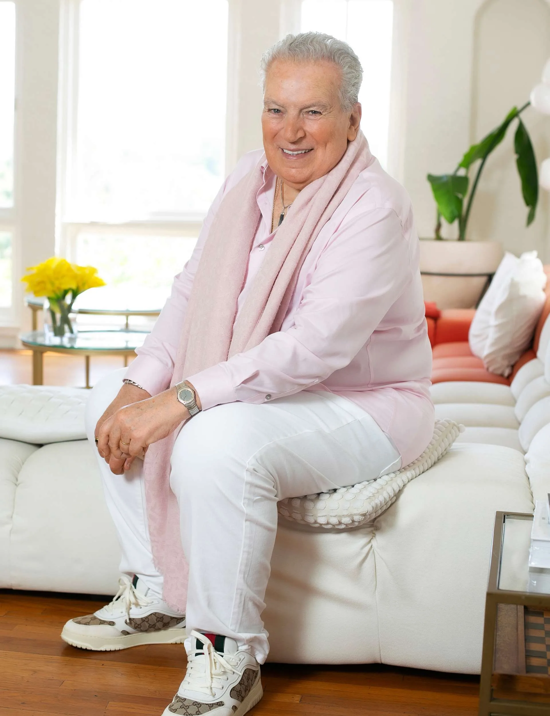 Richard Dalton sitting on a white couch