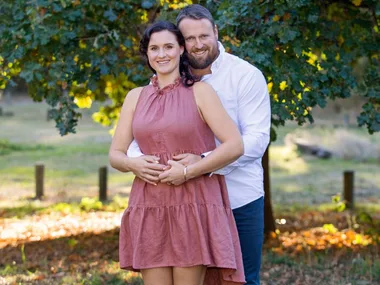 Tom and Dana Walsh holding Dana's belly