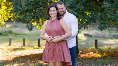 Tom and Dana Walsh holding Dana's belly