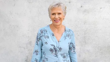 Jennifer Ludlam in front of a concrete wall