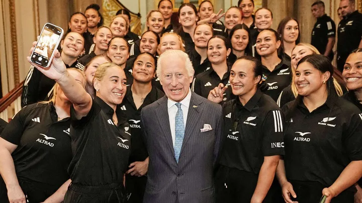 The Black Ferns taking a group selfie with King Charles