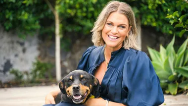 Anna Paterson with a dog on her lap