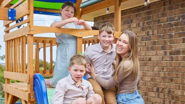 Renee with her kids on a playground