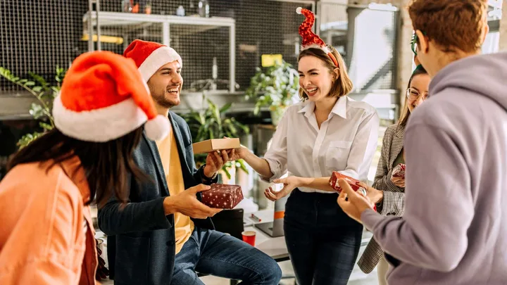 Friends exchanging their best secret santa gifts