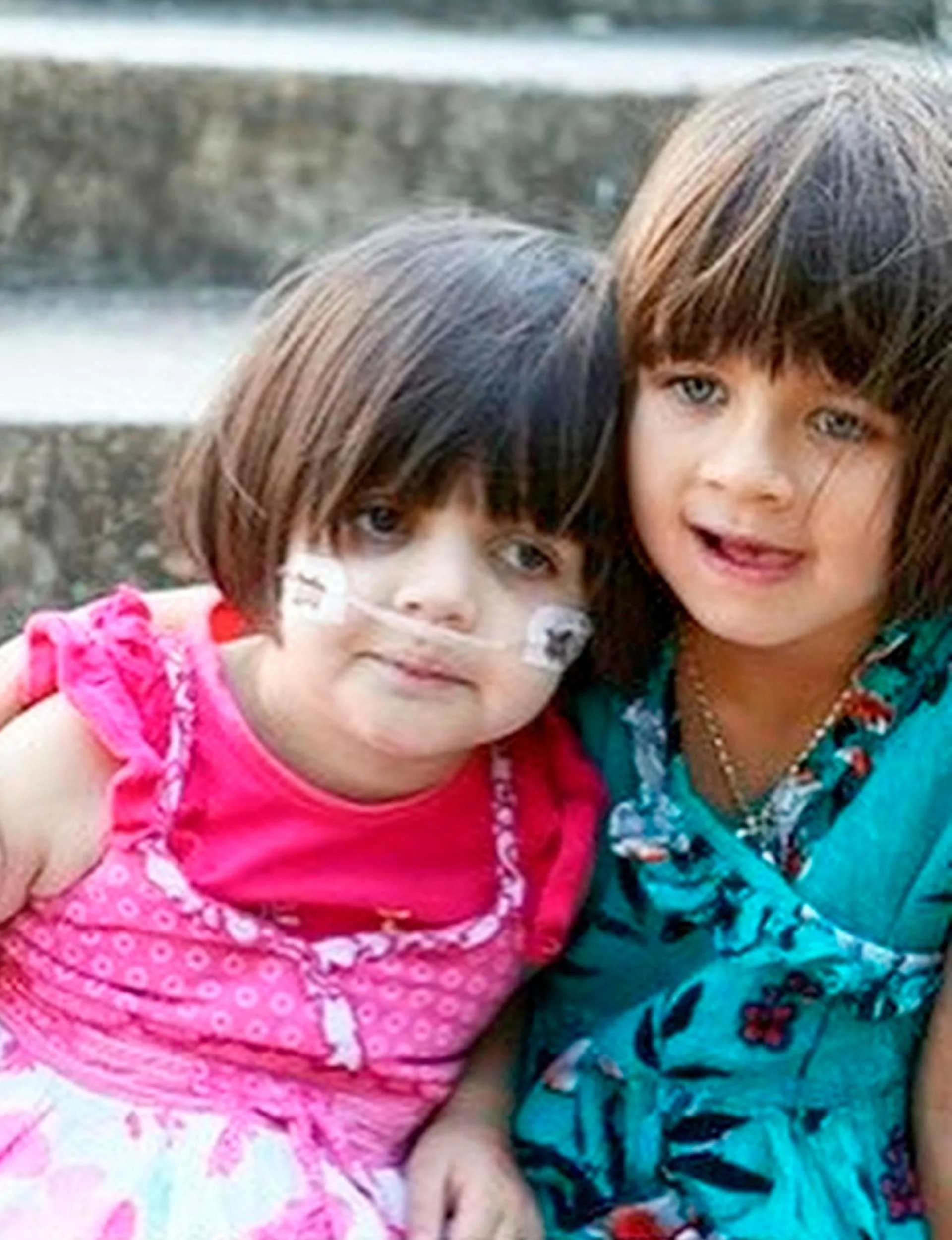 Eva Mitchell with her sister when they were kids