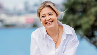 Sarah Gandy smiling in a white shirt