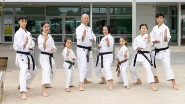 The Mikua family in their karate Do-gi