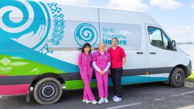 The three staff embers in front of the Te Iti Pounamu Hauora bus