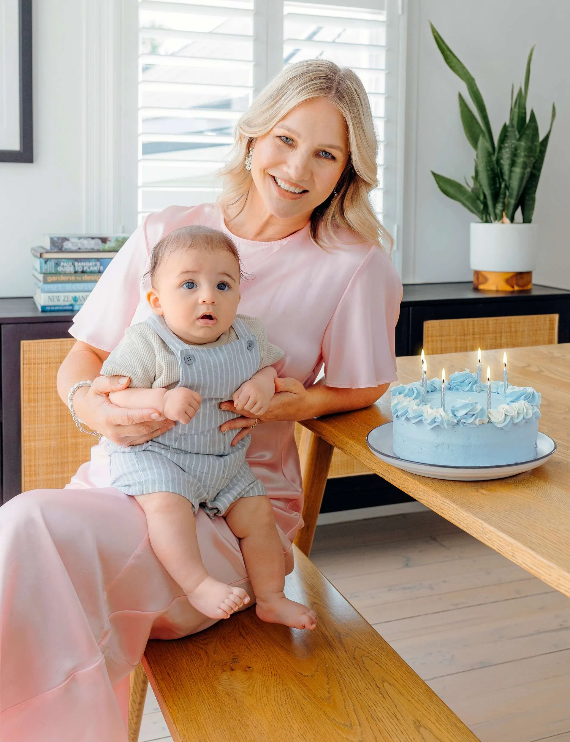 Hayley and Kingston beside a blue cake