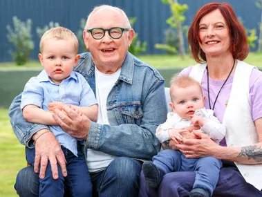 Kevin Milne with his wife and grandchildren