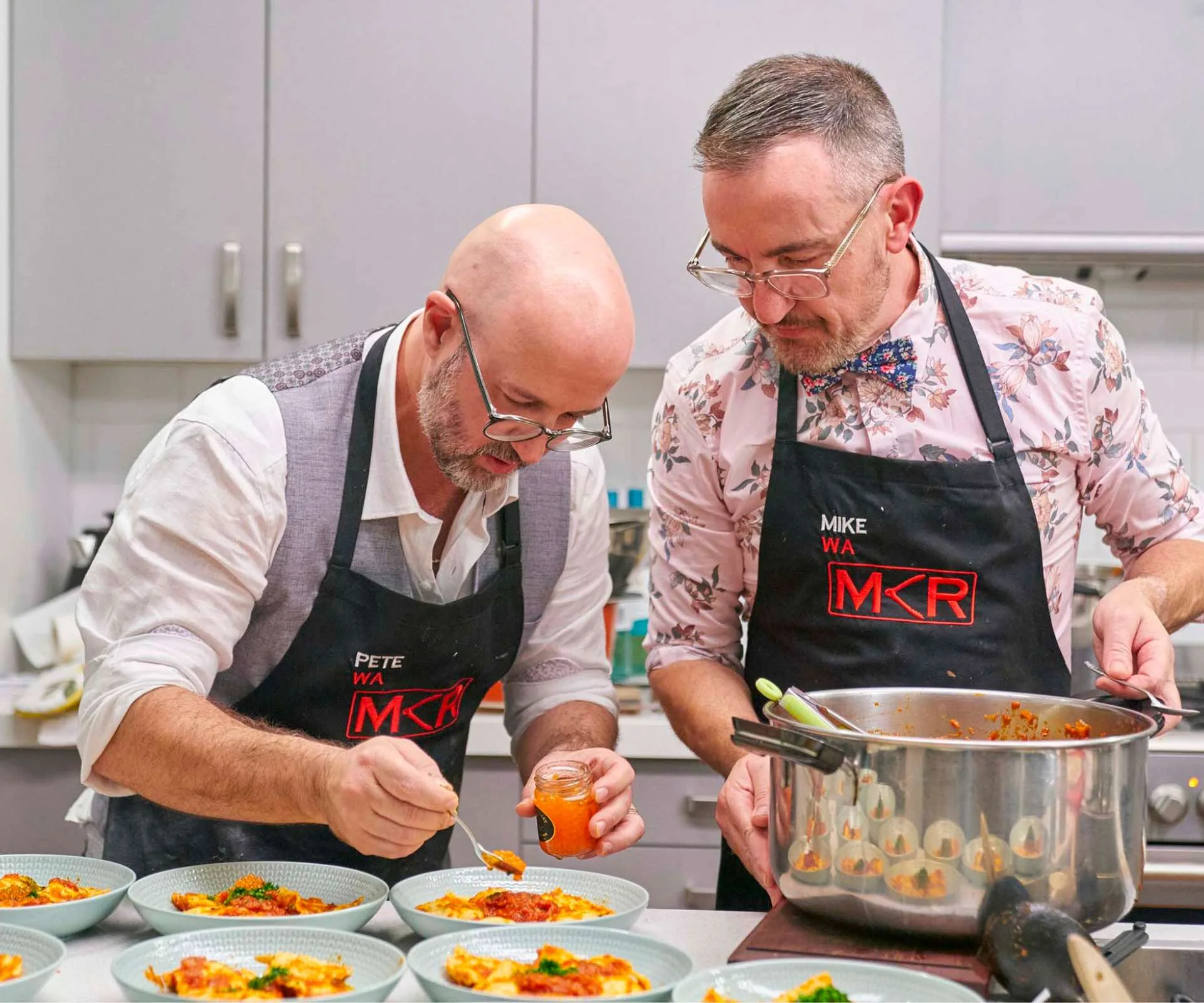 Mike and Pete dishing up plates on MKR